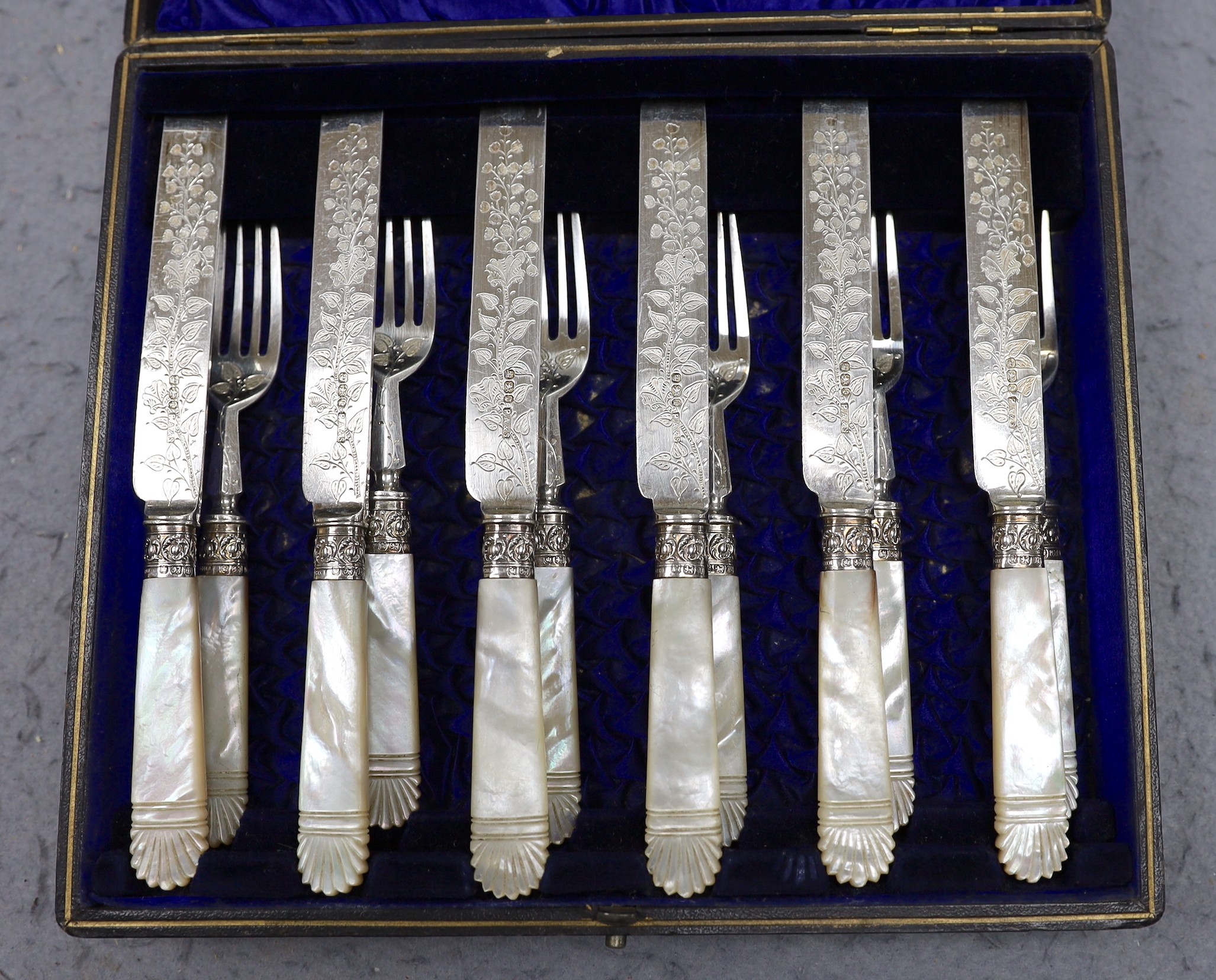 A cased set of six pairs of late Victorian mother of pearl handled silver dessert eaters, P. Ashberry & Sons, Sheffield, 1895.